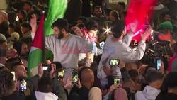 Freed Palestinian prisoners celebrate upon their arrival in Ramallah - AFP