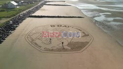 80th anniversary of D-Day marked by large-scale Royal Mint coin drawing on Normandy's beaches - AFP
