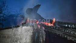 Firefighters battle a blaze in Kharkiv after overnight Russian drone strikes - AFP