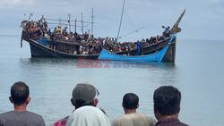 Boat with hundreds of Rohingya refugees spotted off Indonesia - AFP