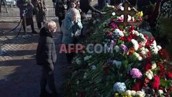 Navalny supporters flock to his grave to pay their respects - AFP