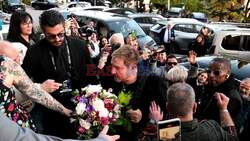 *EXCLUSIVE* Ahead of Valentines, Duran Duran's Simon Le Bon holds a bouquet of flowers as he arrives for the festival of Sanremo.