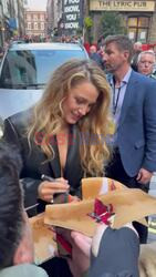 Blake Lively signs autographs for fans as she arrives to a private screening of Another Simple Favor at ham yard hotel London