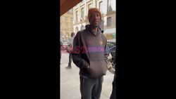 CLIP 1/2: Travis Scott spotted arriving in Paris while hiding his face from cameras