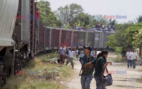 Migrants riding on top of train toward the US-Mexico border
