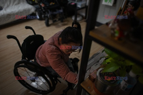 Ciężkie życie osób na wózkach w Chinach - AFP
