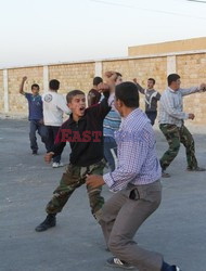 Free Syrian Army youth soldiers attend a training camp 