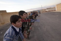 Free Syrian Army youth soldiers attend a training camp 