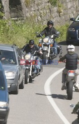 George Clooney takes a motorcycle ride to a lake in Como
