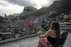Turystyka w faweli Rocinha - AFP
