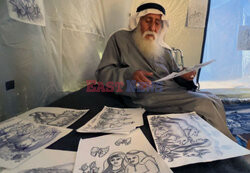 Starszy Palestyńczyk utrwala wojnę w obrazach