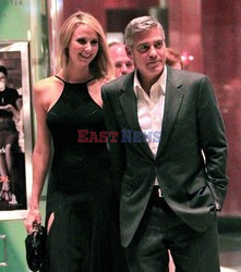 George Clooney and Stacy Keibler walks through the Time Warner Center 