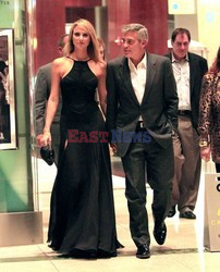 George Clooney and Stacy Keibler walks through the Time Warner Center 